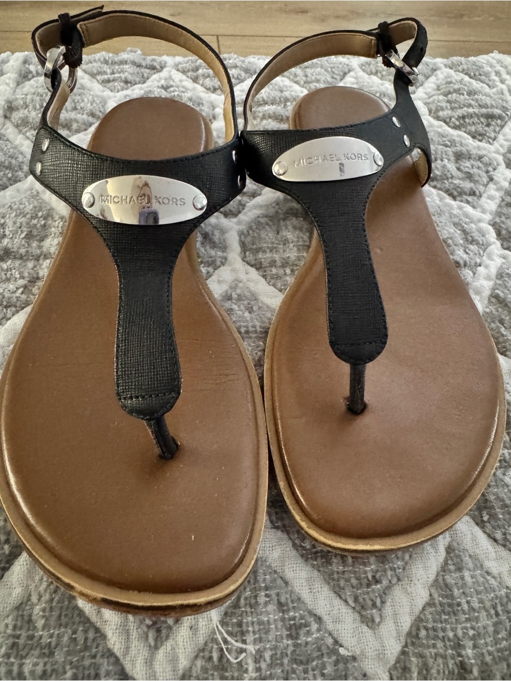 Michael Kors Black and Brown T-Strap Logo Plate Sandals